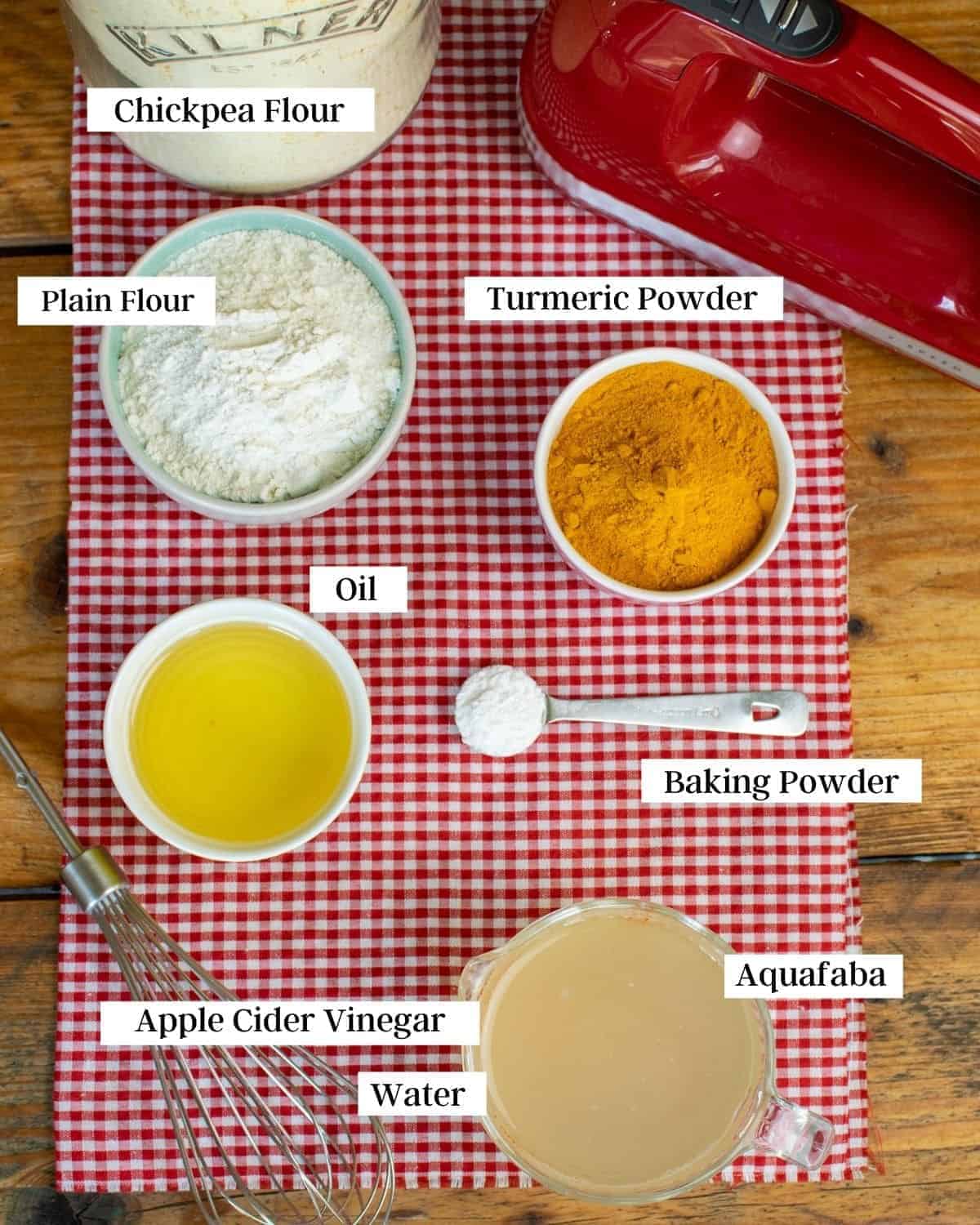 All of the ingredients for this recipe laid out on a red and white cloth