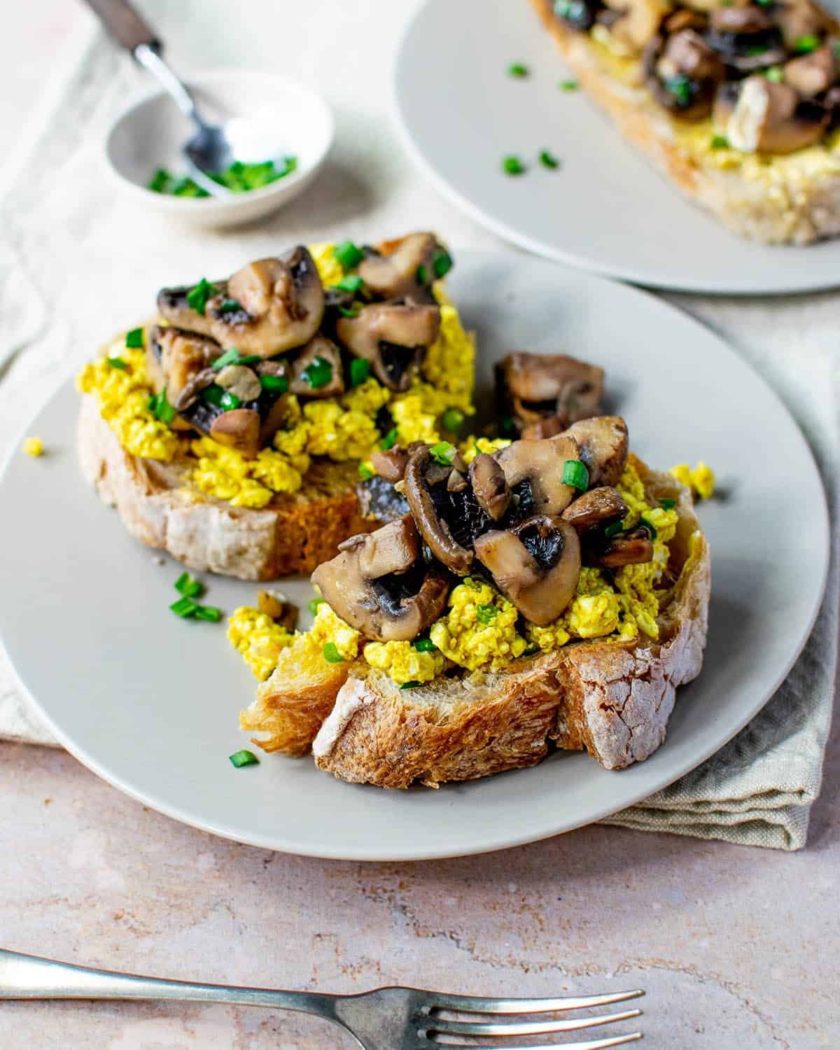 Vegan garlic mushrooms on toast with silken tofu scramble