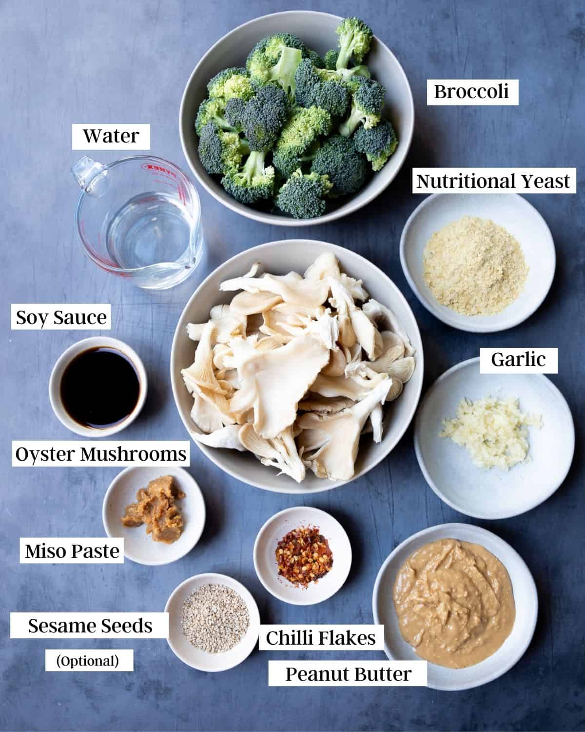 Ingredients in bowls on a dark surface.