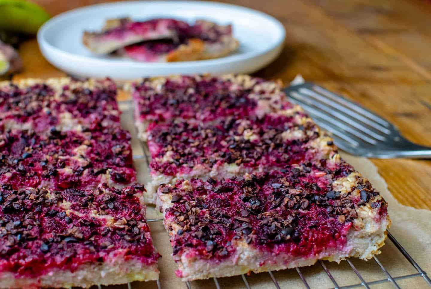 Vegan baked oatmeal with raspberry and chocolate nibs