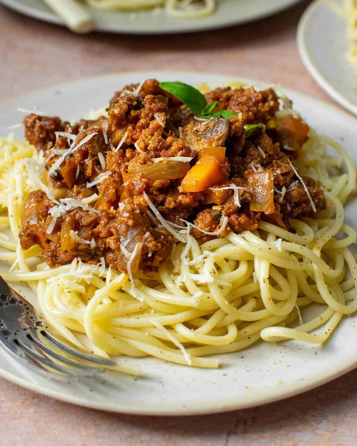 Close up of vegan spaghetti bolognese with mushrooms and carrots