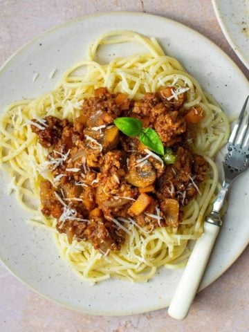 Vegan Spaghetti Bolognese on a plate with a fork