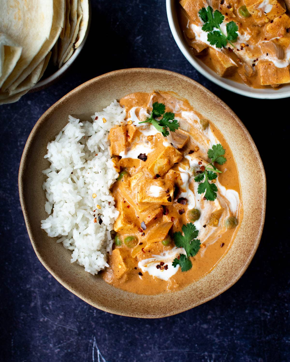 Top down view of vegan butter chicken curry with rice