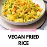 Vegan fried rice in a bowl with a Pinterest title underneath.