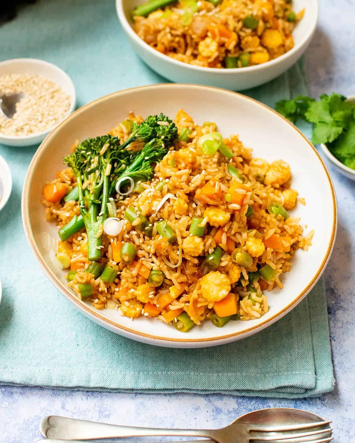 Vegan kimchi fried rice in a bowl with a second bowl in the background