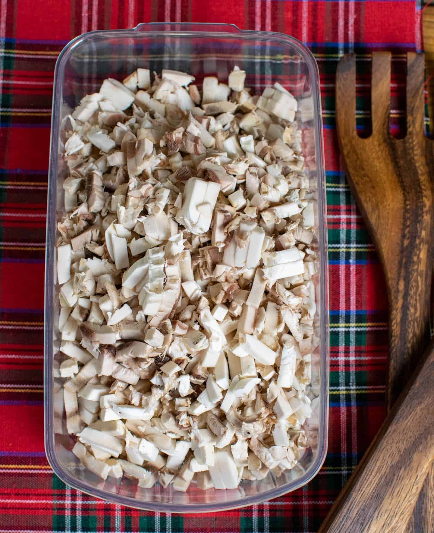 Finely diced mushrooms in a (Nicer Dicer) plastic tub