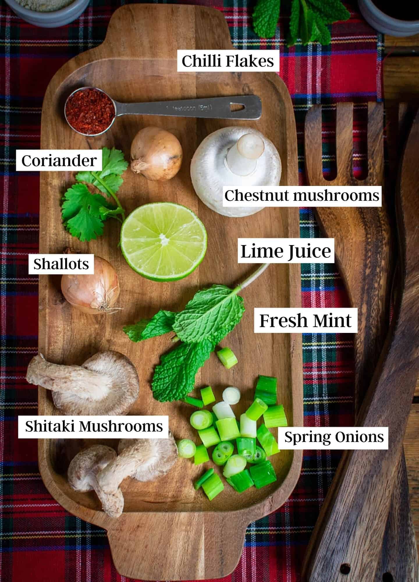 Ingredients laid out and labelled on a wooden tray