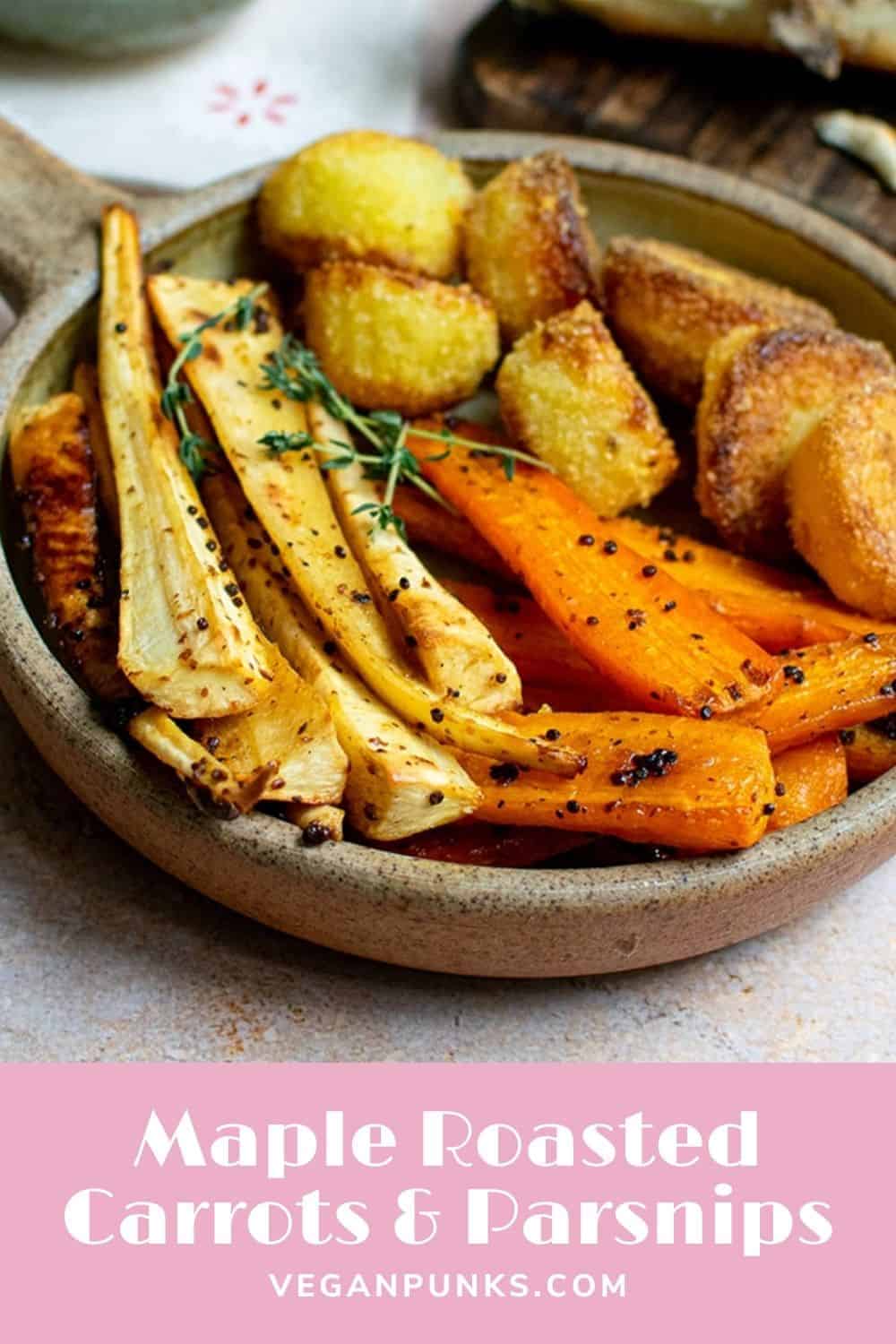 A Pinterest image titled Maple Roasted Carrots & Parsnips. A stoneware bowl is filled with carrots and parsnips. The veg is golden brown and has a few mustard seeds stuck to them.