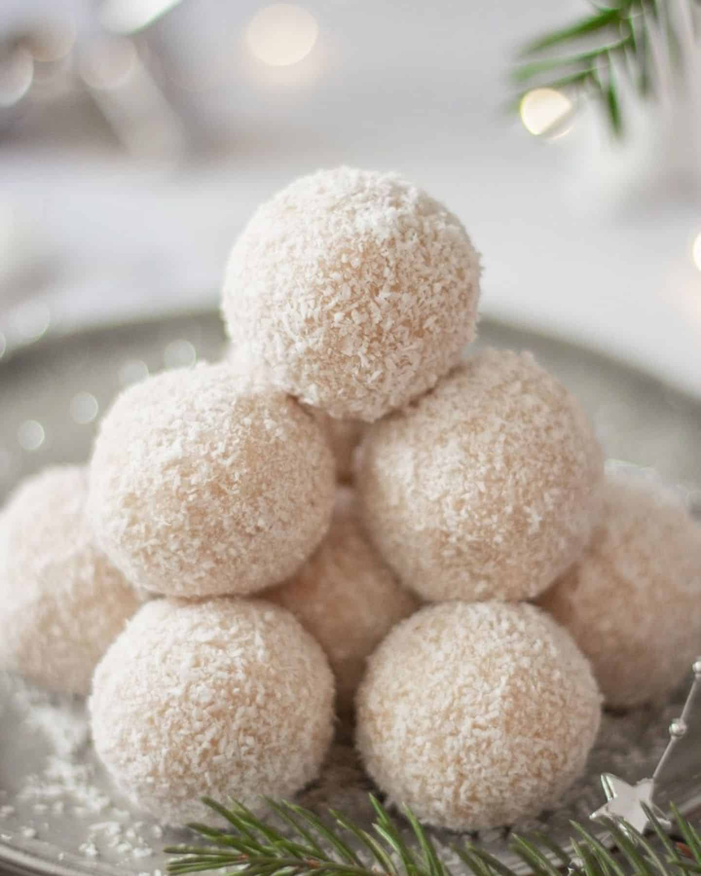 Vegan snowballs piled high with a Christmas tree branch poking in