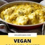 Pinterest image showing vegan cauliflower cheese being held in an orange dish with text on a yellow background as the title