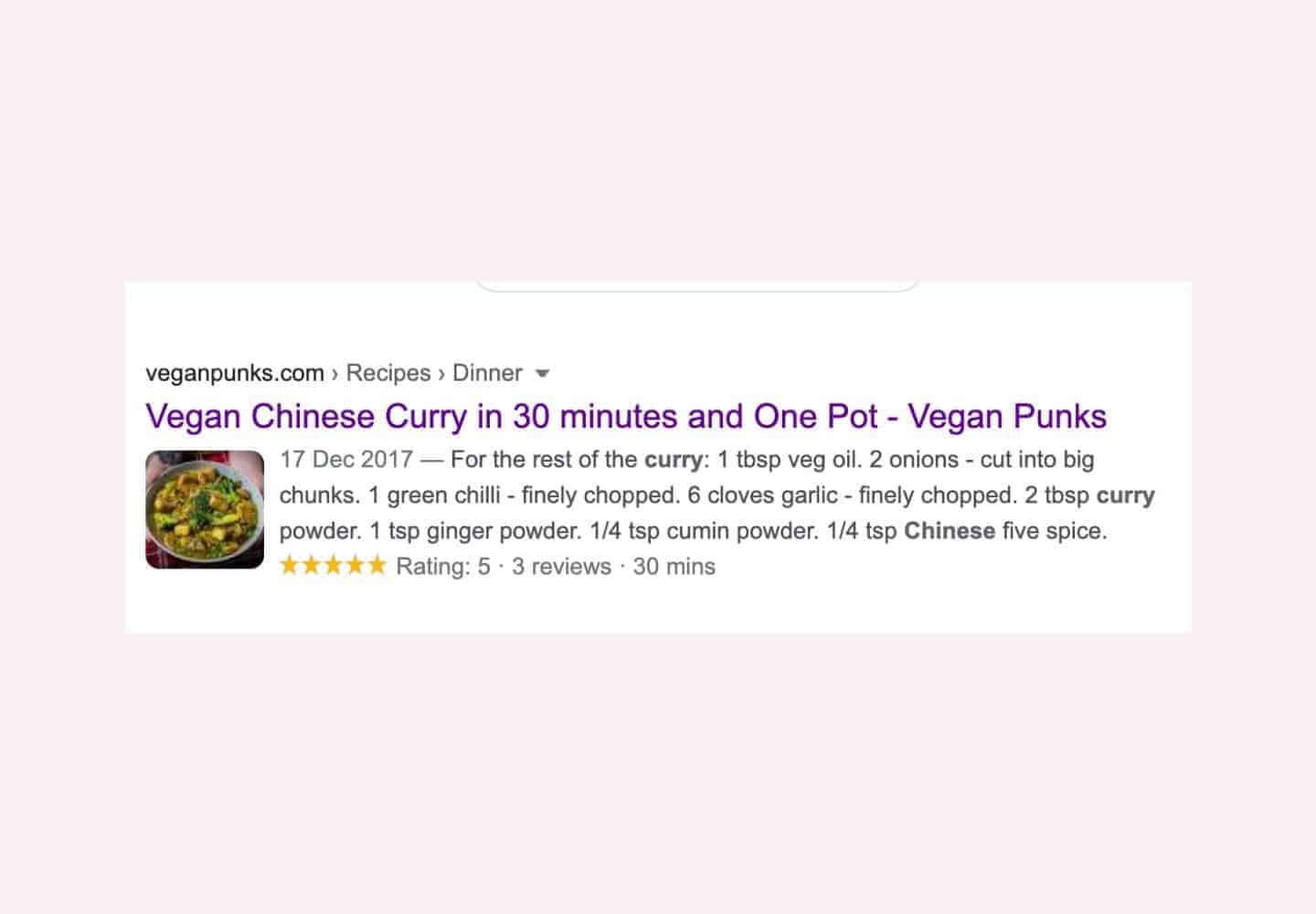 A screenshot of one of our recipes – Chinese Curry showing as the first result on Google, set on a light pink background