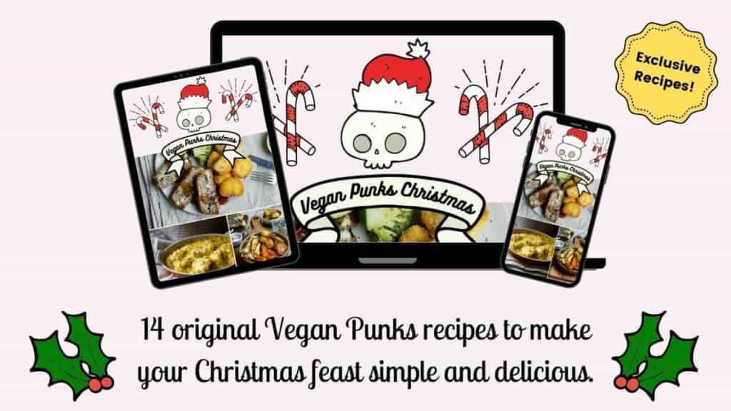 A promotional image for A Vegan Punks Christmas recipe e-book. It features mock-ups of the book on a laptop, iPad and phone.