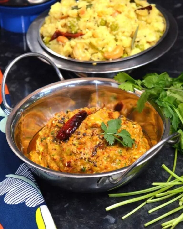 Courgette chutney in a balti dish with fresh coriander.