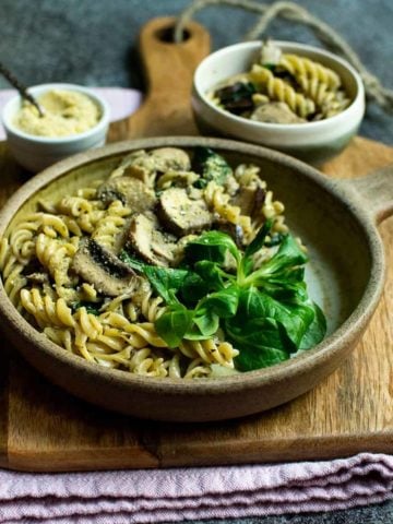 A bowl of vegan mushroom pasta with creamy garlic sauce