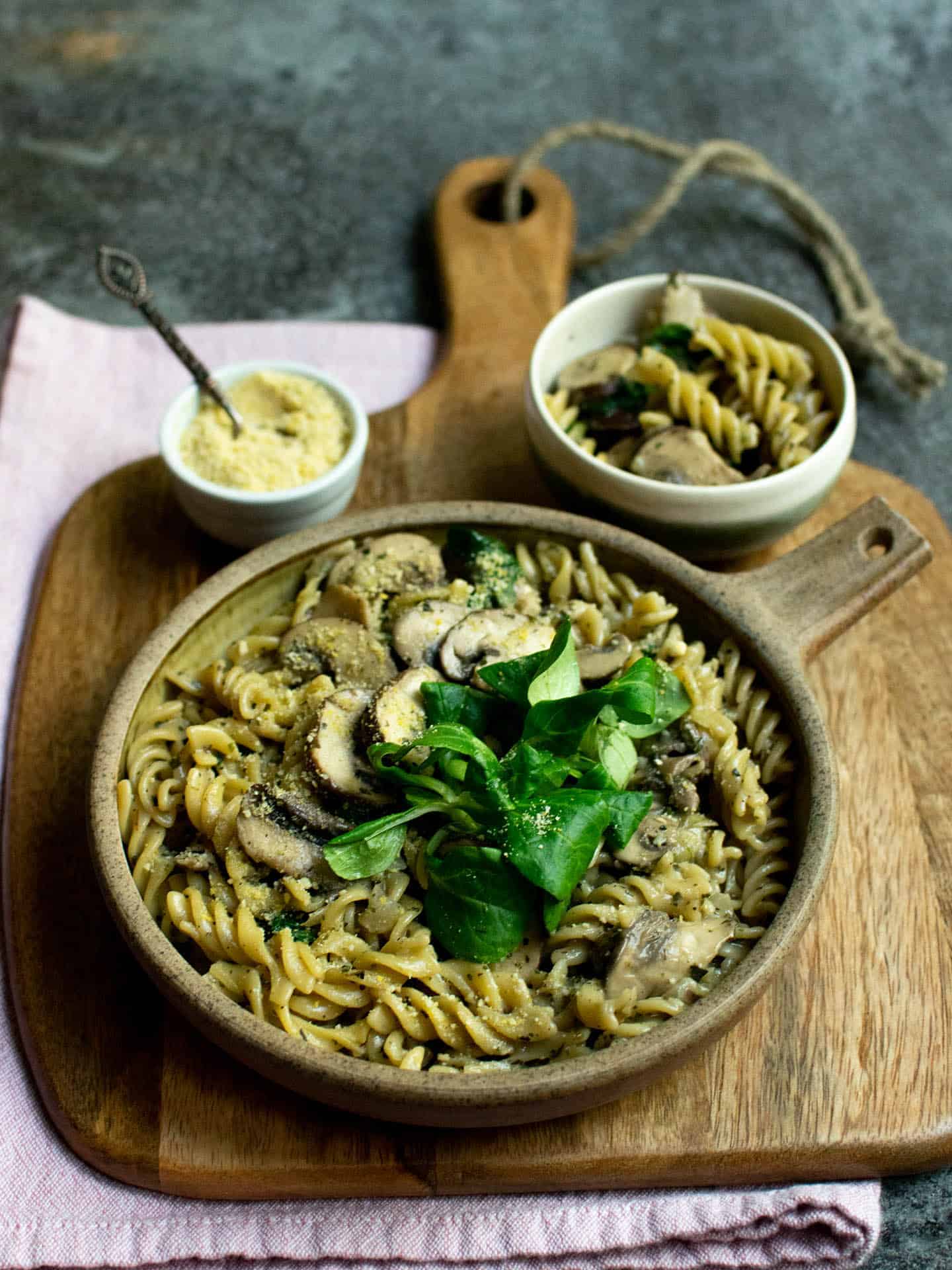 A bowl of herby and creamy mushroom pasta.