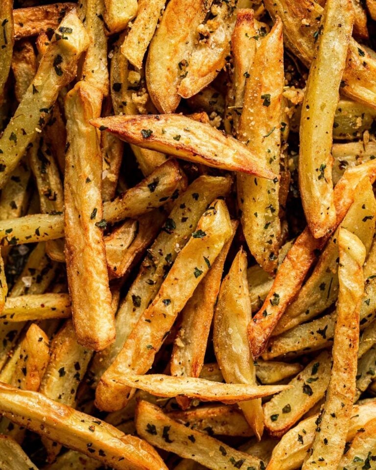 Garlic fries covered in fresh herbs.