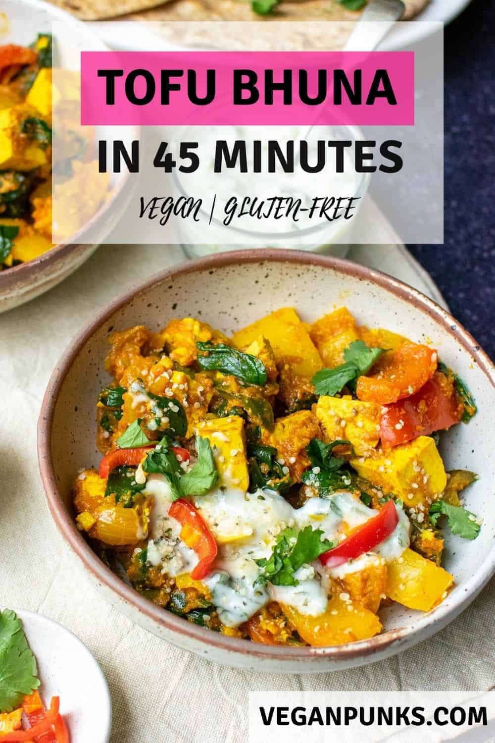 A close up of a bowl of vegan bhuna with peppers, tofu and spinach. The title says 'Tofu Bhuna in 45 minutes'