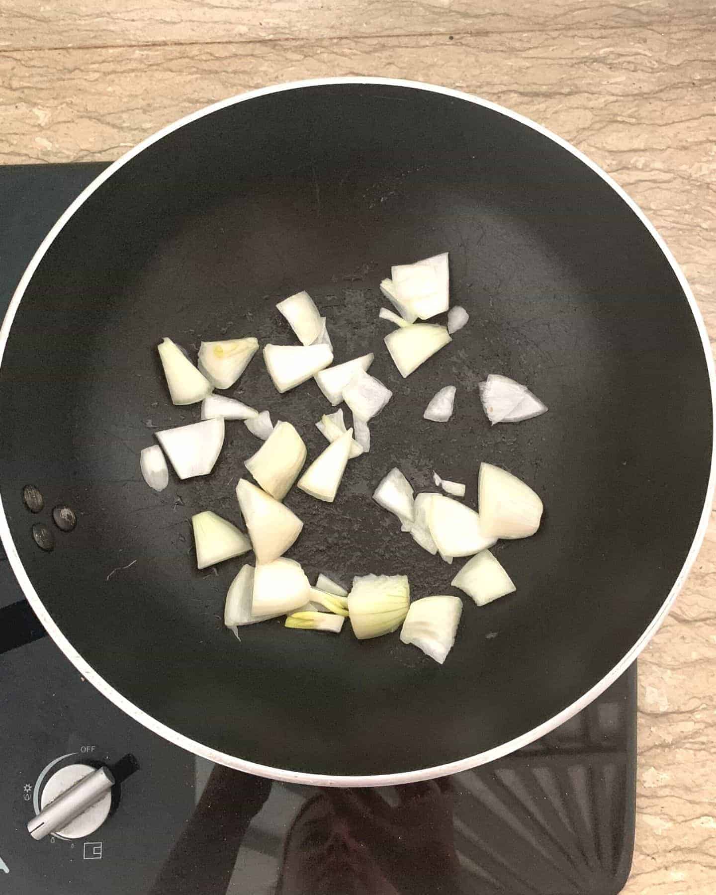 Top down view of onion in a pan