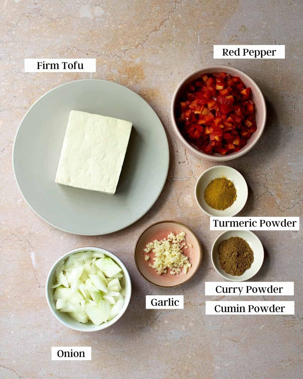 Ingredients for curried tofu scramble laid out in individual pots