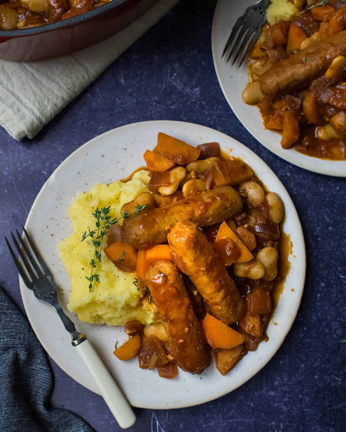 Top down view of vegan sausage casserole with a casserole dish