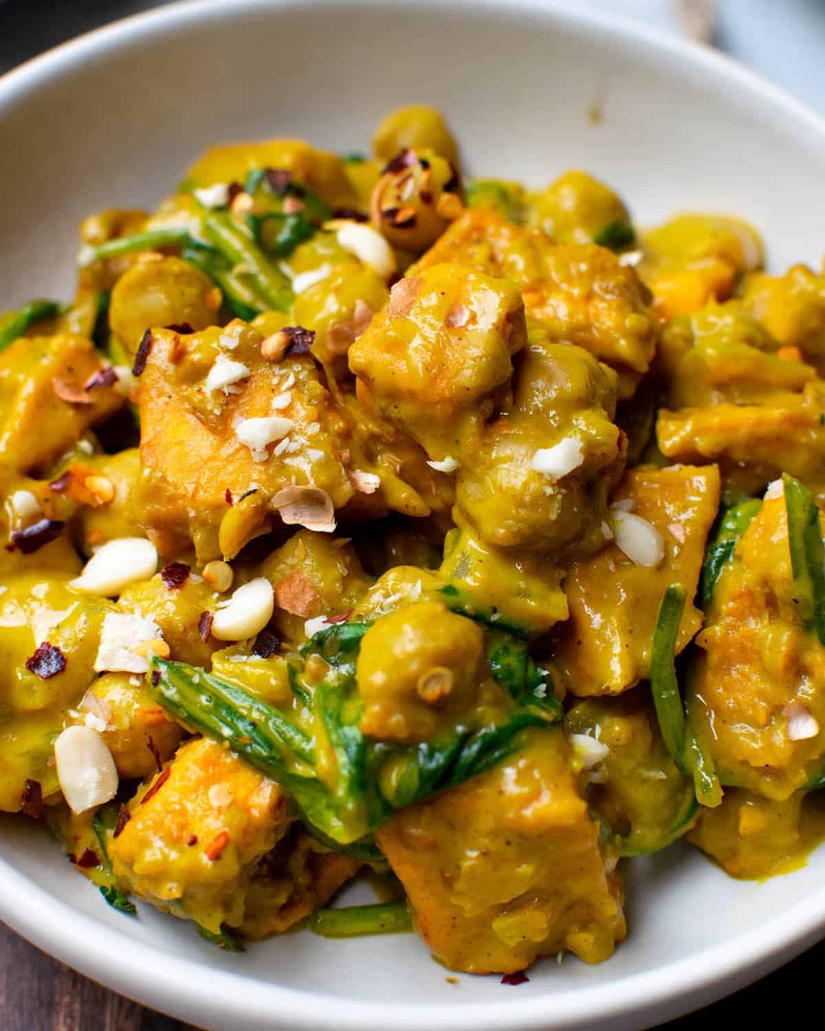 Satay sweet potato curry with spinach close up
