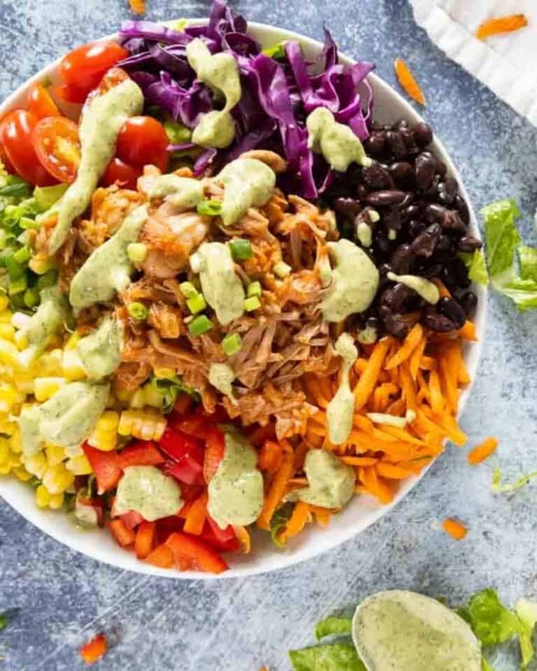 Colourful jackfruit salad featuring beans, carrot, sweetcorn and tomato.