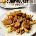 Vegan currywurst on a plate with a Pinterest title above.