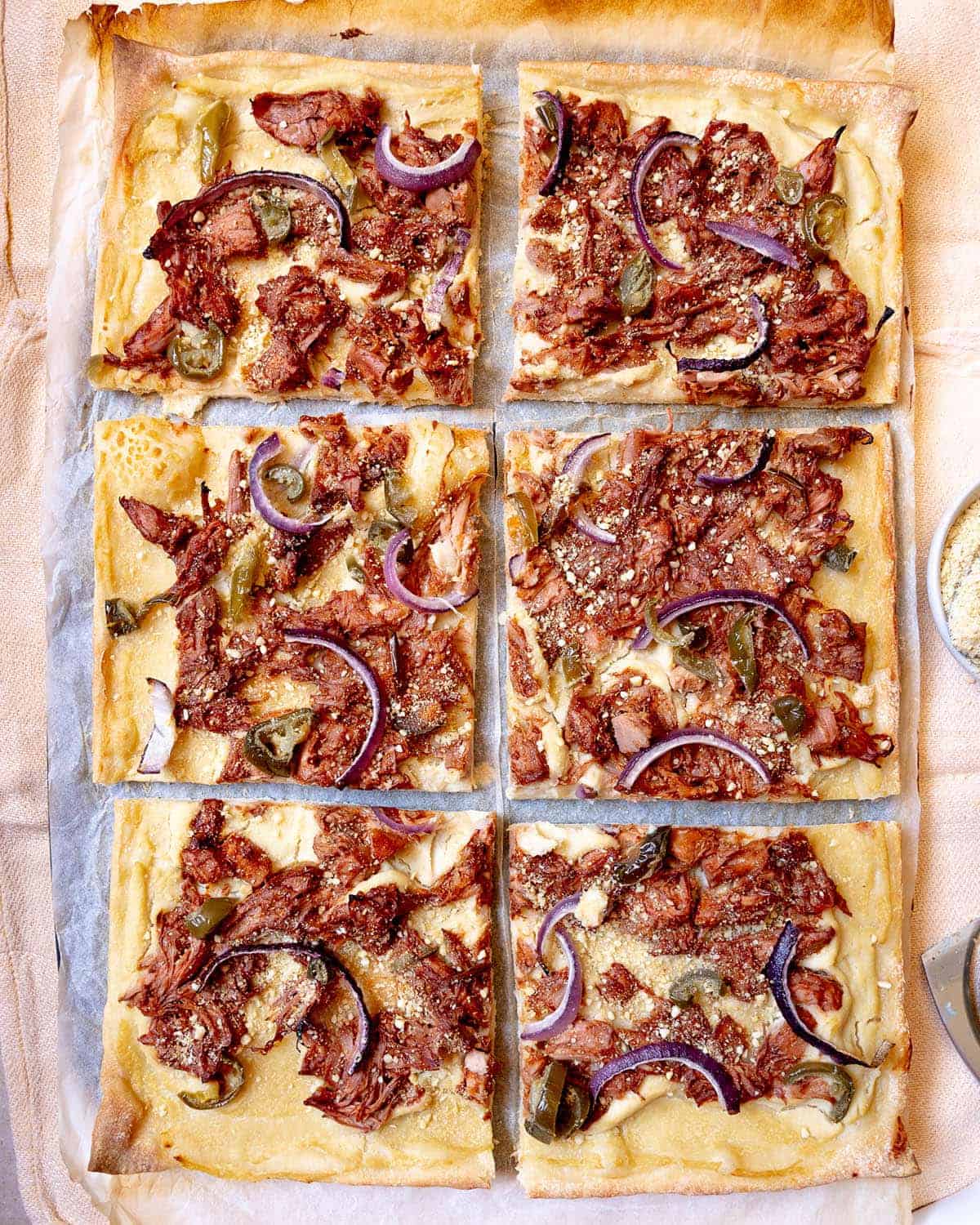 Jackfruit pizza cut into six pieces.