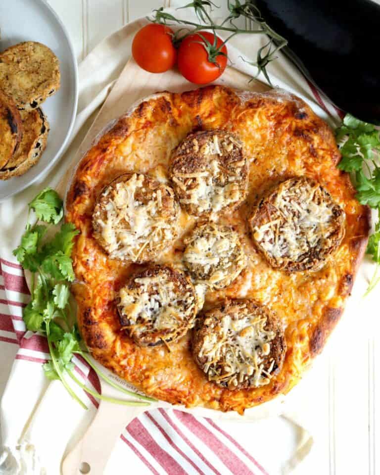 Eggplant pizza topped with vegan cheese.