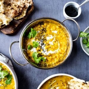 Matar dal in a balti dish served with naan bread.