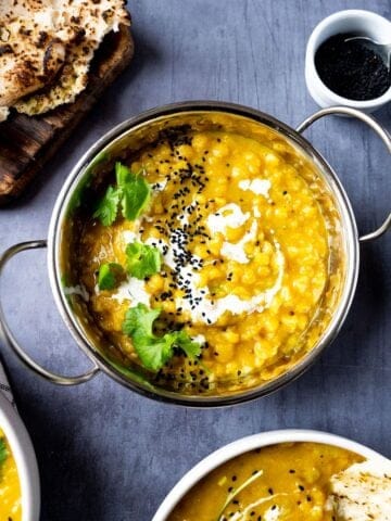 Matar dal in a balti dish served with naan bread.