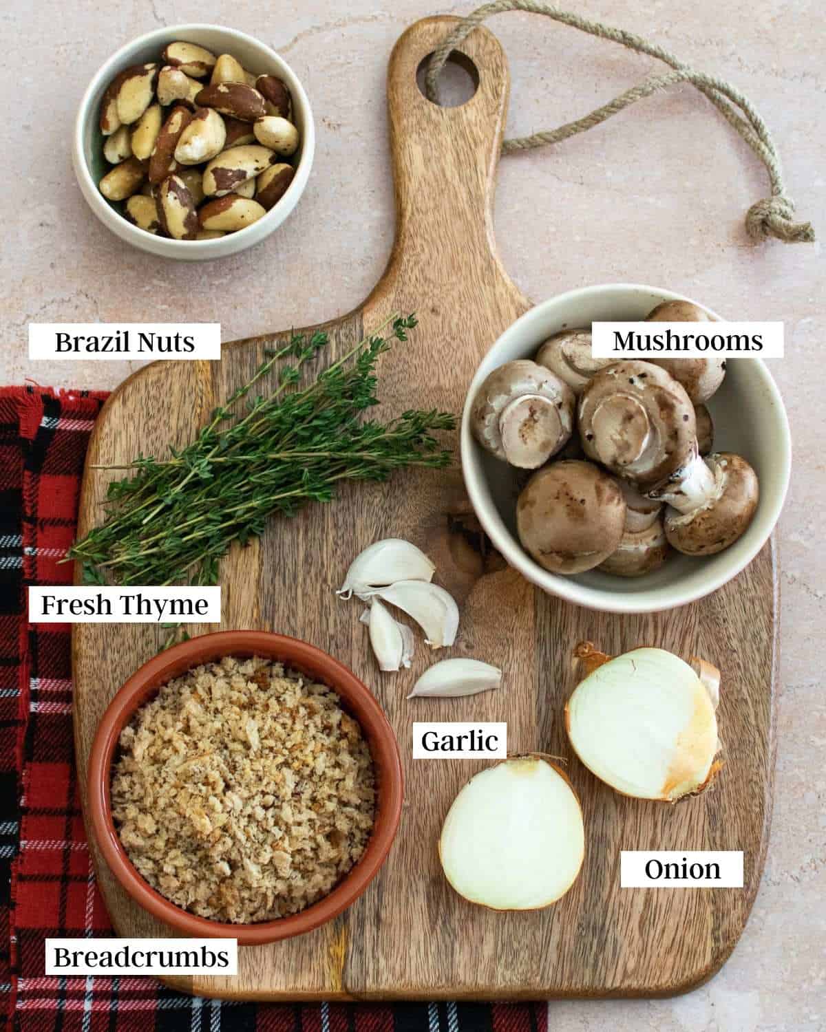 Ingredients for a mushroom wellington on a cutting board.