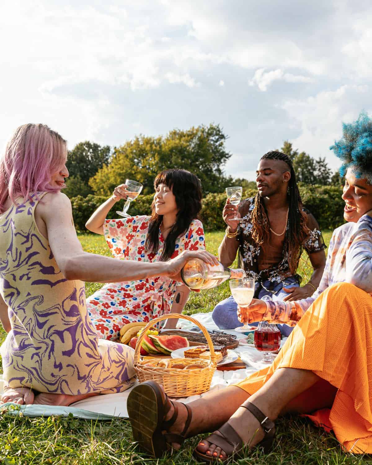 People having a picnic in a field.