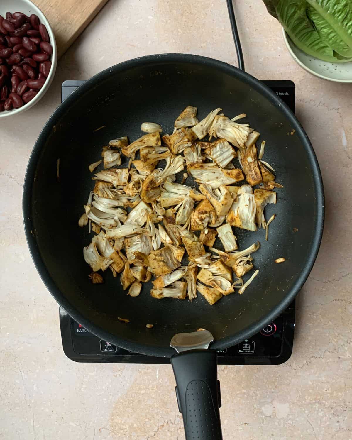 Shredded jackfruit in a pan.