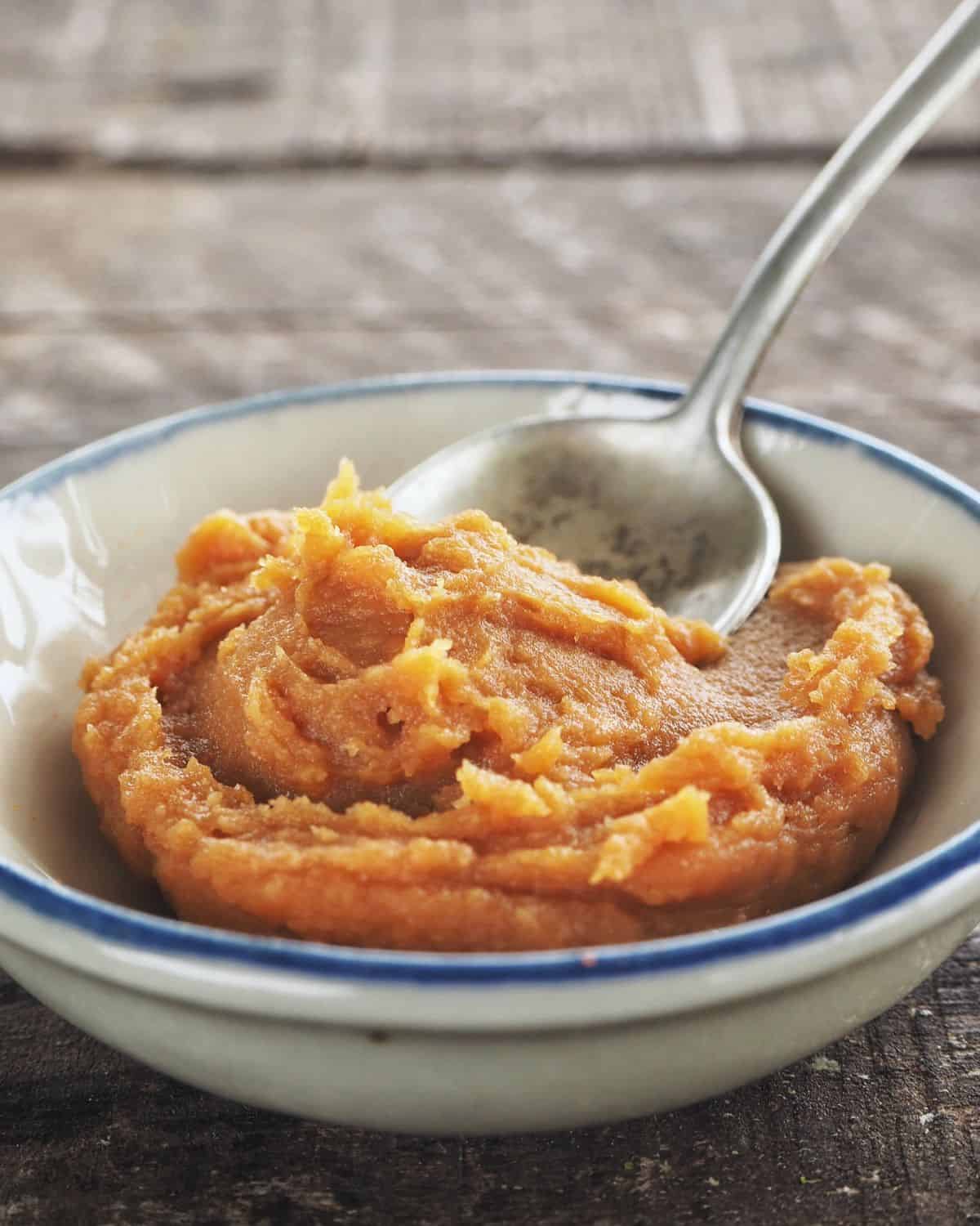 Miso paste in a bowl with a spoon.