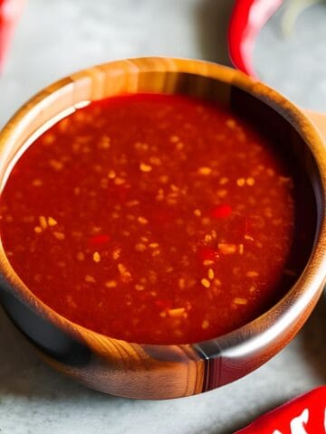 Sweet chili sauce in a wooden bowl.