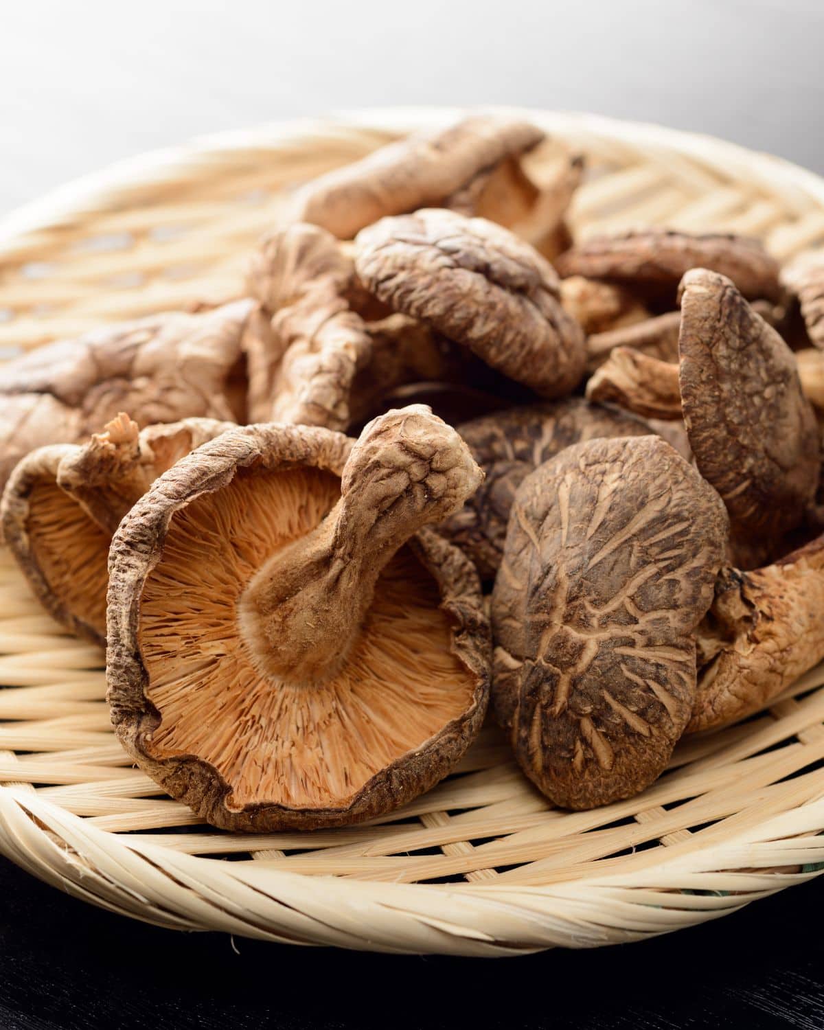 Dried mushrooms in a woven basket.