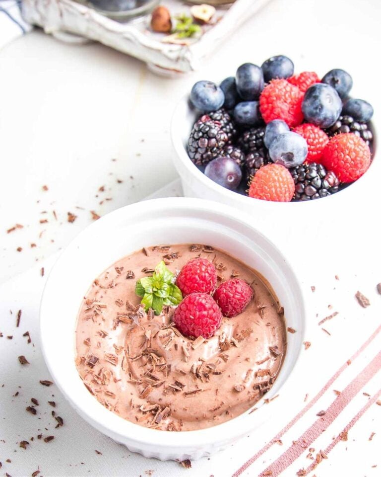 Chocolate pudding with berries and mint.