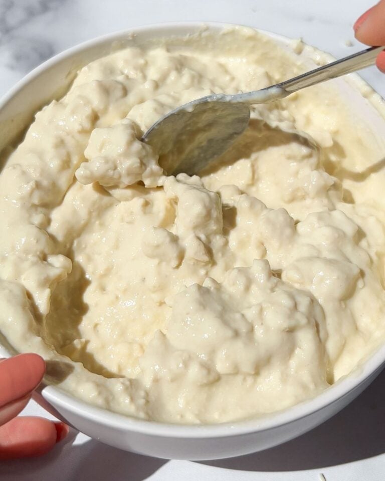 Vegan cottage cheese in a bowl with a spoon.