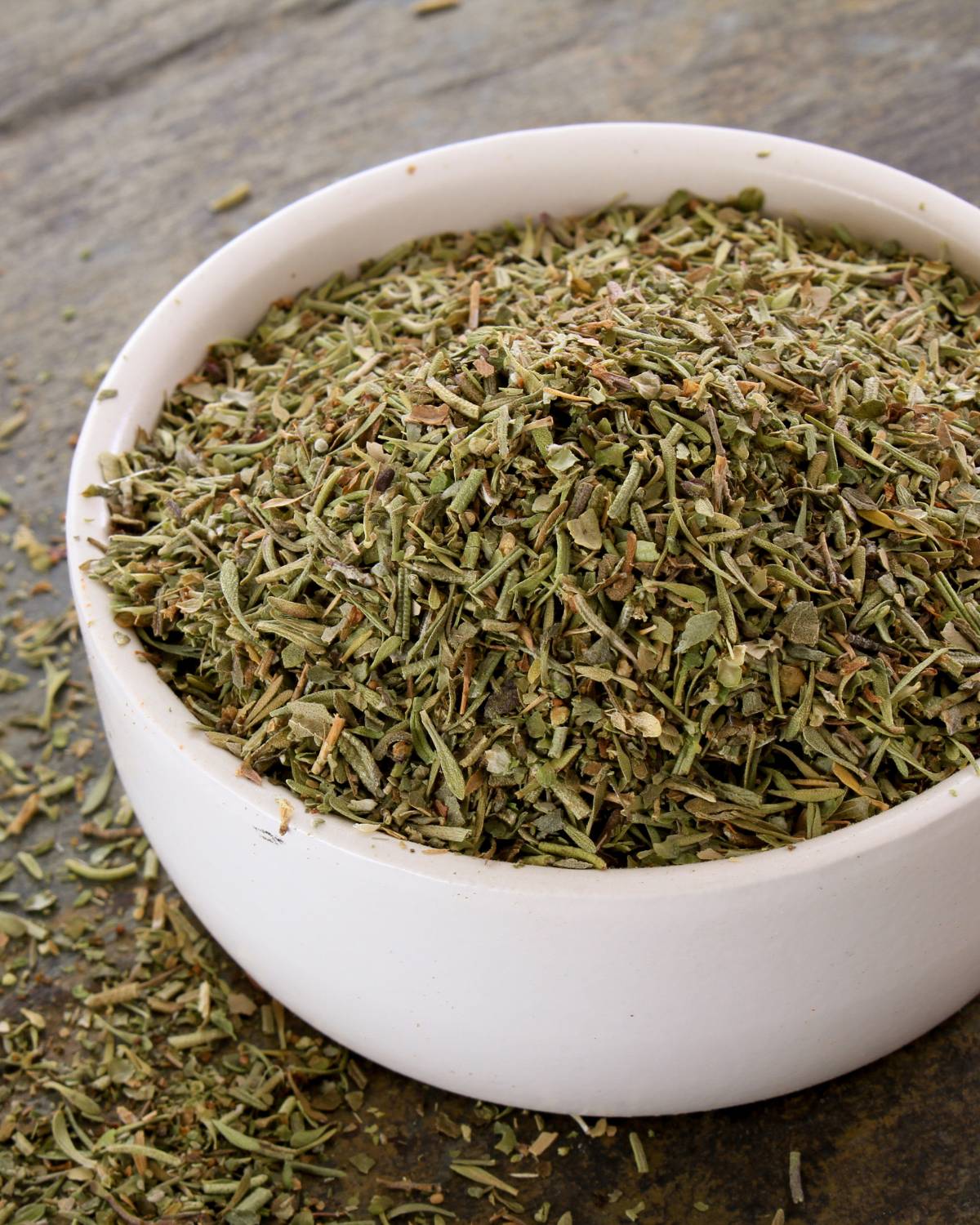 Dried mixed herbs in a bowl.