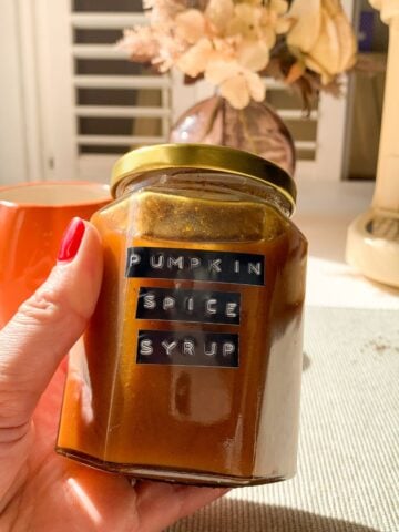 Pumpkin spice syrup in a glass jar.