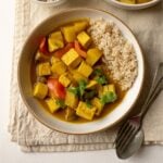Vegan Thai yellow curry in a bowl with rice.